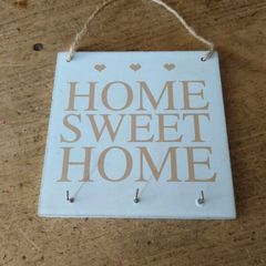 rustic wooden "Home Sweet Home" plaque  decorative wall art piece  small heart motifs, and metal hooks for keys