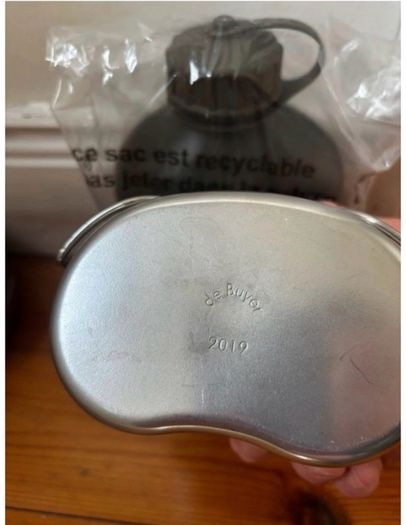 Genuine army-style metal water bottle with matching nesting cup. Military surplus