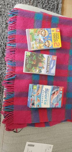 nintentendo switch with lots of games and sports pack accessories
