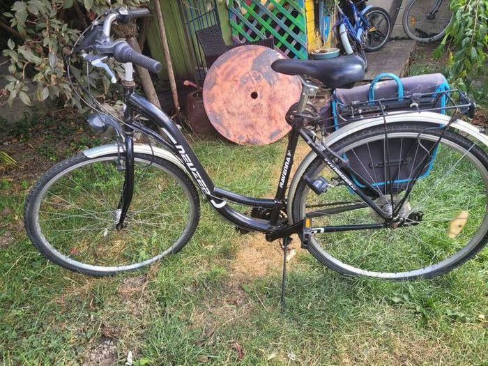 ladies bike with carrier bags and lock
