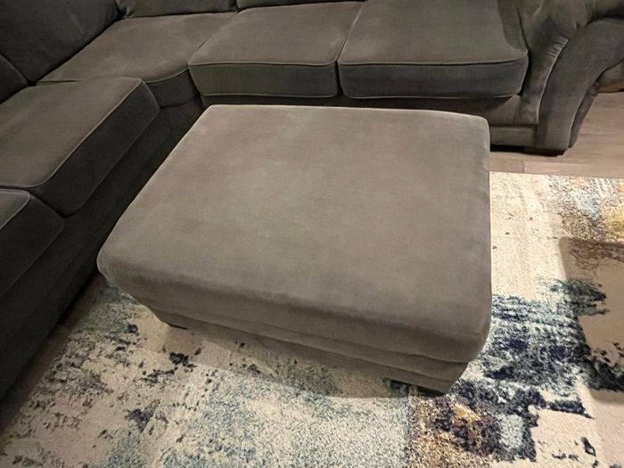 Grey corner sofa with matching footstool