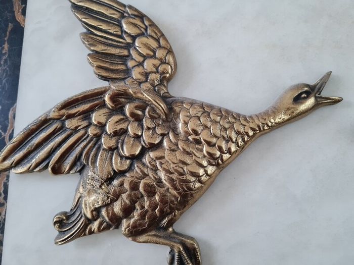brass flying ducks