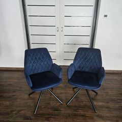 Swivel velvet armchair