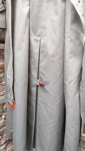 Vintage Nuage ladies trenchcoat Approximately late 90s early 00s Size 10 on label The colour is a pale bluey grey with brown buttons It's got an inner lining that can be removed