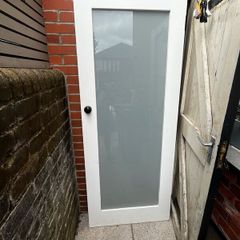Hardwood interior door with frosted glass panel