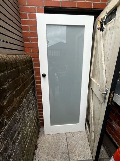 Hardwood interior door with frosted glass panel