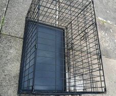 large dog cage with added wheels