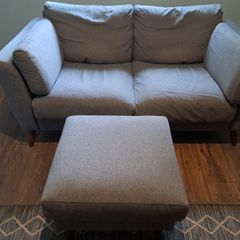 Two seater grey couch with footstool