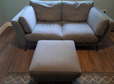 Two seater grey couch with footstool
