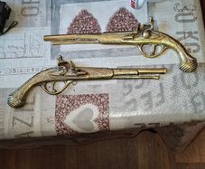 Beautiful Vintage Pair Of Brass Flintlock Dueling Pistols Wall Hangers, likely from the 1940s Postage Available or Collection