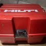 Hilti PM 4M Multi-Line Laser  Hilti PM 4M cordless multi-line laser with 360-degree rotation base, including the original red hardshell carry case. Image 2