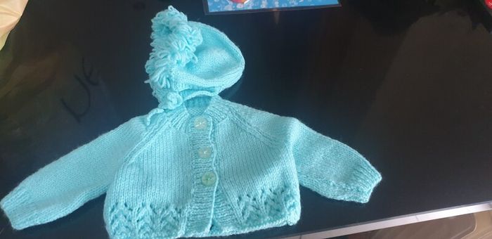 Hand knit baby cardigan and bonnet
