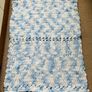 Handknit baby blanket super soft chenille yarn baby blue and white mix. Image 3