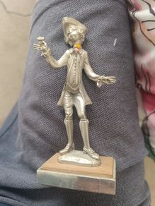 The figurine is a vintage