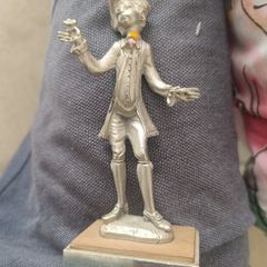 The figurine is a vintage