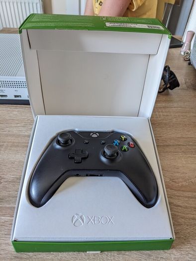 Xbox One S 1TB with controller and cables.