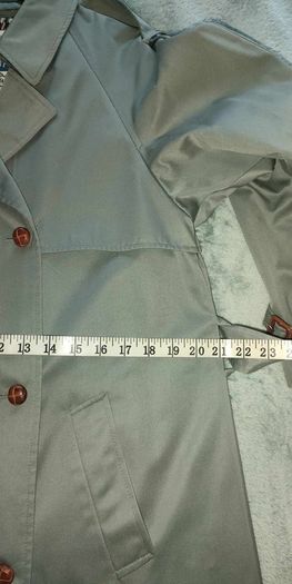 Vintage Nuage ladies trenchcoat Approximately late 90s early 00s Size 10 on label The colour is a pale bluey grey with brown buttons It's got an inner lining that can be removed