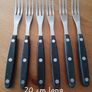 A 12-piece stainless steel steak knife and fork set with wooden riveted handles. Image 10