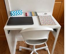 White desk + office chair on wheels