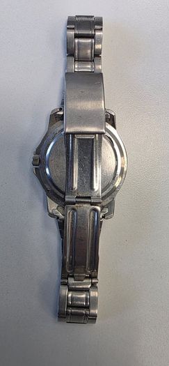Silver-toned Reflex Quartz wristwatch with a white wave-patterned dial