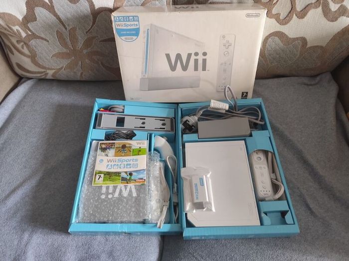 Wii with box, two controllers, sports and HDMI adapter