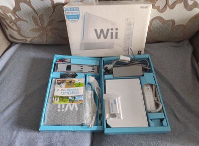Wii with box, two controllers, sports and HDMI adapter