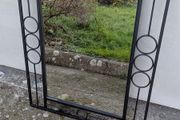 Mirror in a black metal frame