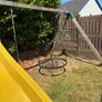 treehouse with swings slide climbing wall and gym bar Image 3