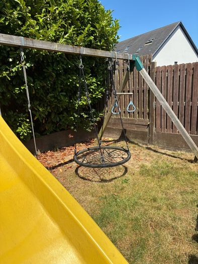 treehouse with swings slide climbing wall and gym bar