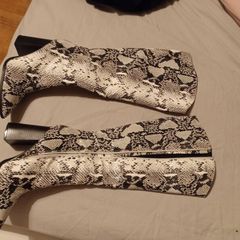 Black and white snake skin boots