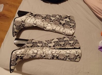 Black and white snake skin boots