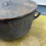 Antique cast iron tri-legged dutch oven and lid. Image 3