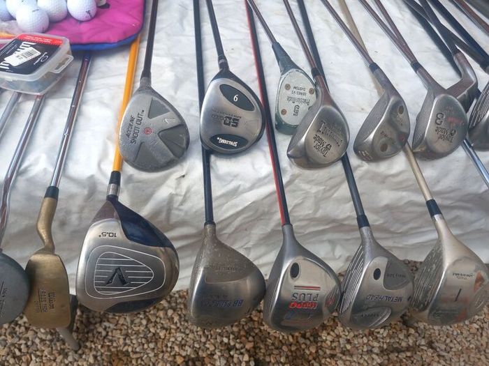 A selection of golf clubs and bags. Golf balls