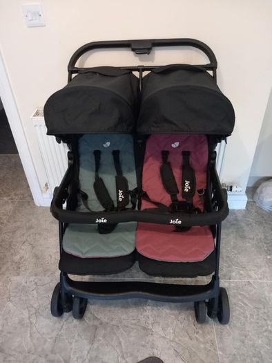 Joie double baby's buggie with rain covers