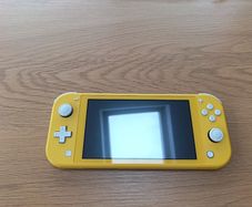 Nintendo Switch Lite (Yellow) + 5 Games + Case