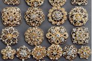 24 Gold Brooches