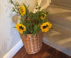 Wicker Stair Basket with Handle with Free Tall Glass vase and sunflowers if still in good condition- see all photos - as new