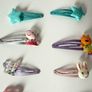 Assortment of girls hair clips and Braclets Image 3