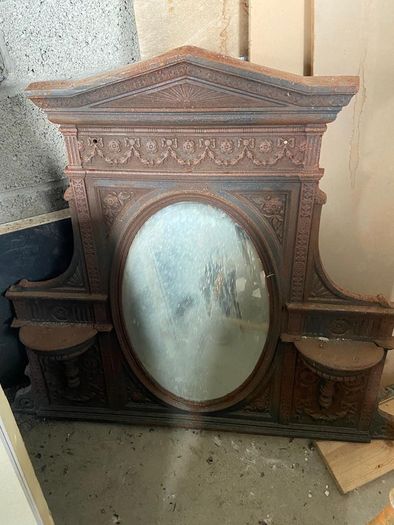 Late Victorian / early Edwardian style cast iron fireplace with tiled inserts and a decorative mantel surround
