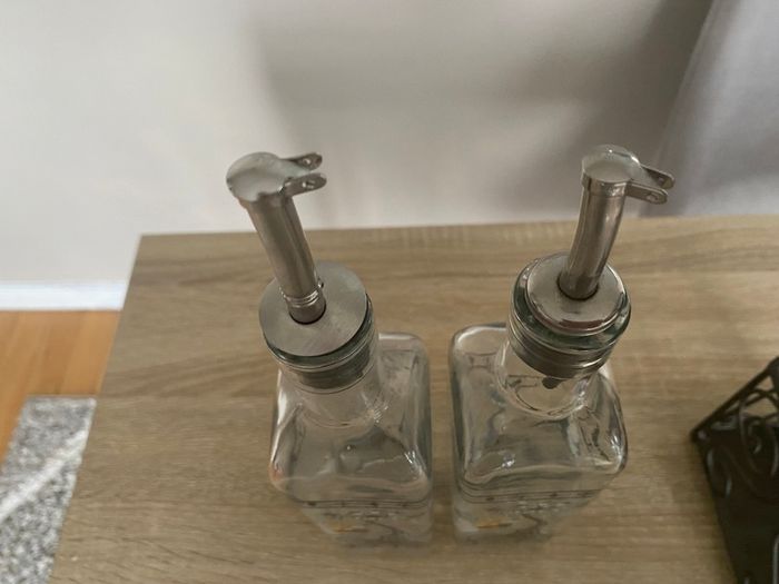Reduced Set of tall oil and vinegar bottles in stand