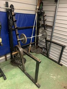 Squat rack - full sets of plated weights and bars