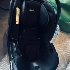 silver cross base and car seat