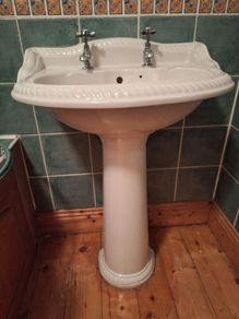 bathroom sink and pedestal
