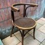 A vintage 1920s Thonet style bentwood chair with armrests. Image 2