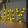 New bespoke 21.5cm high pre lit JOY sign with faux moss Image 3