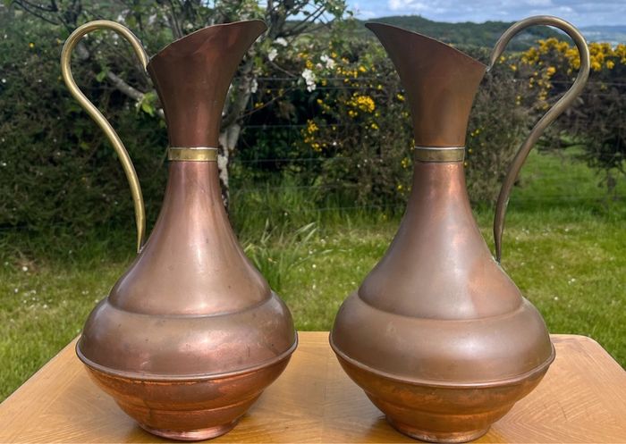 Pair of antique copper jugs