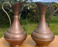 Pair of antique copper jugs