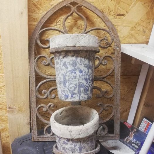 Vintage wrought iron plant hangers. Porcelain containers