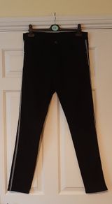 Black pinstripe trousers