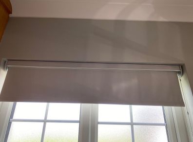 3 elegant roller blinds with open cassette pelmet.